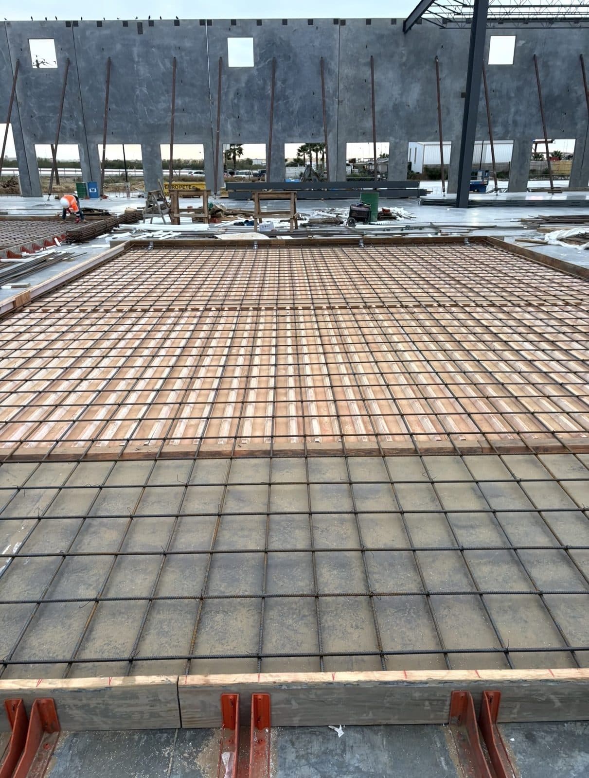 Rebar reinforcement laid out and tied for a concrete slab pour