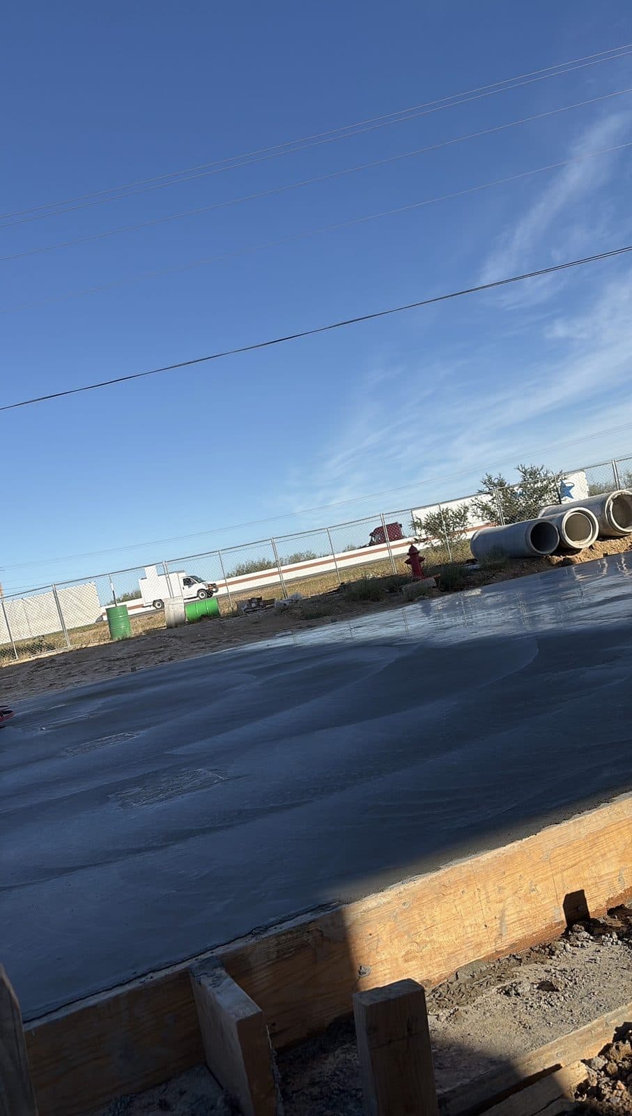 Smooth, freshly finished concrete slab poured by 2J Concrete Services